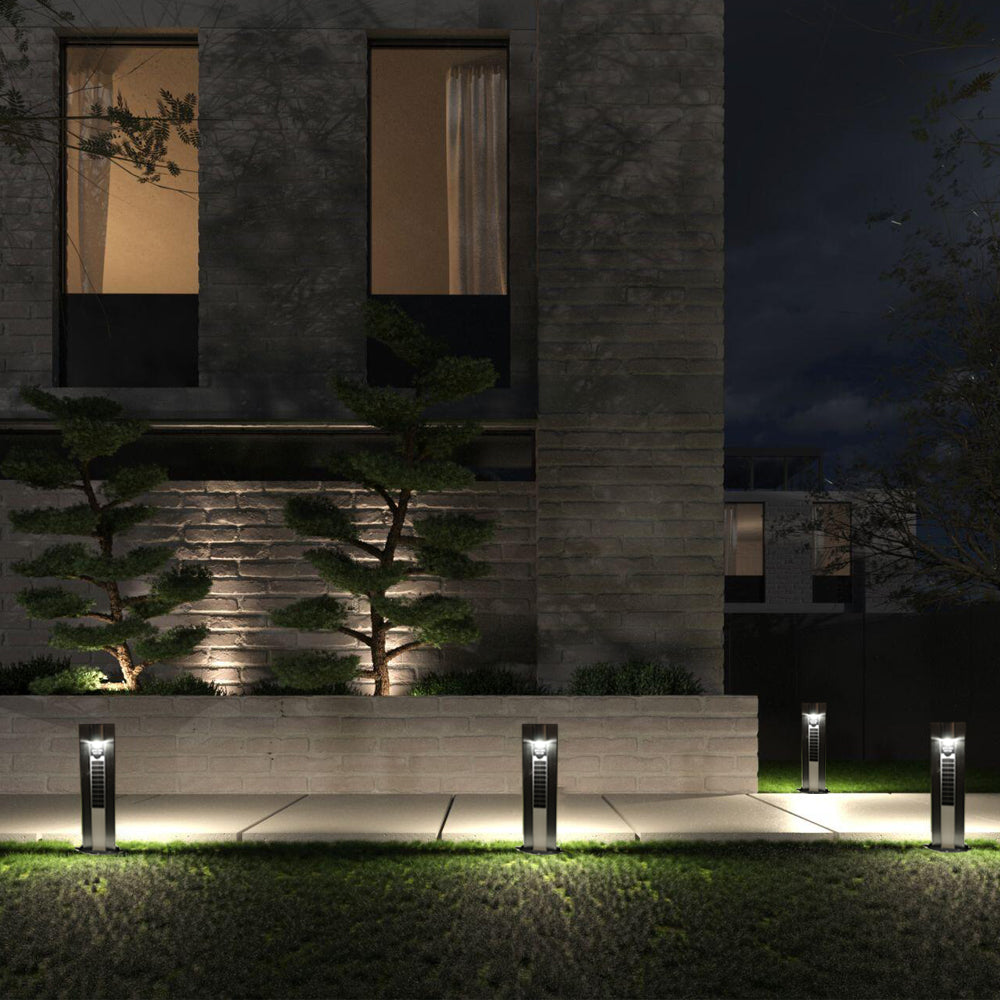 Row of EV-GL-116 solar bollards lighting a house front at night