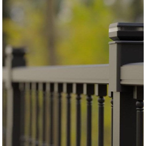 Pure White solar garden light staked in a garden bed at night
