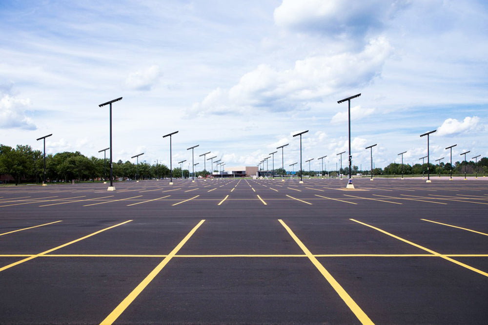 Solar parking lot lights installed across a large car park