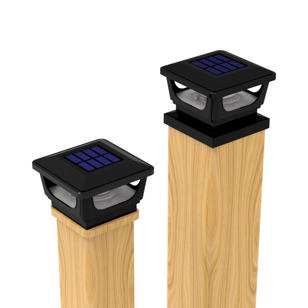 Solar post cap light on a timber fence post