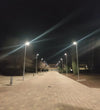 EVIEKO solar street lights illuminating a pathway at night