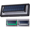 Aluminium solar wall light with sound sensor glowing blue on a wall