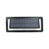Aluminium solar wall light with sound sensor glowing blue on a wall