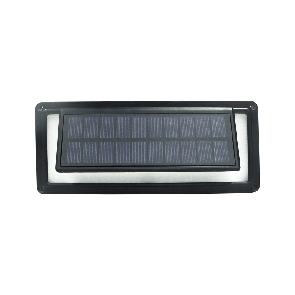 Aluminium solar wall light with sound sensor glowing blue on a wall