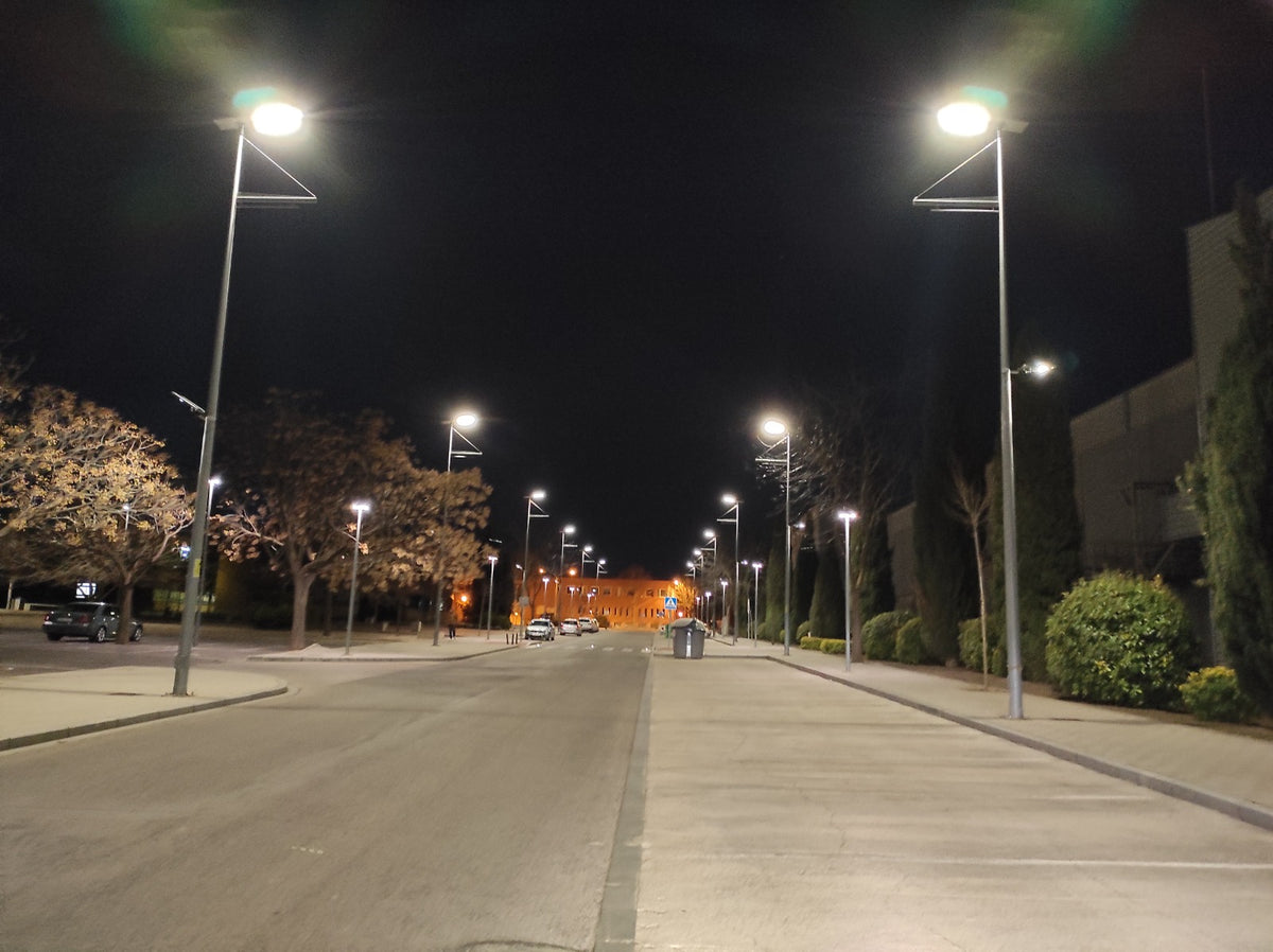 Solar street lights illuminating a road at night