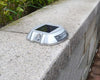 EVIEKO solar road stud installed on a kerb