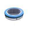 Mini floating solar pool light glowing warm white on water at night