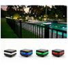 RGB Colour-Changing solar garden light staked in a garden bed at night