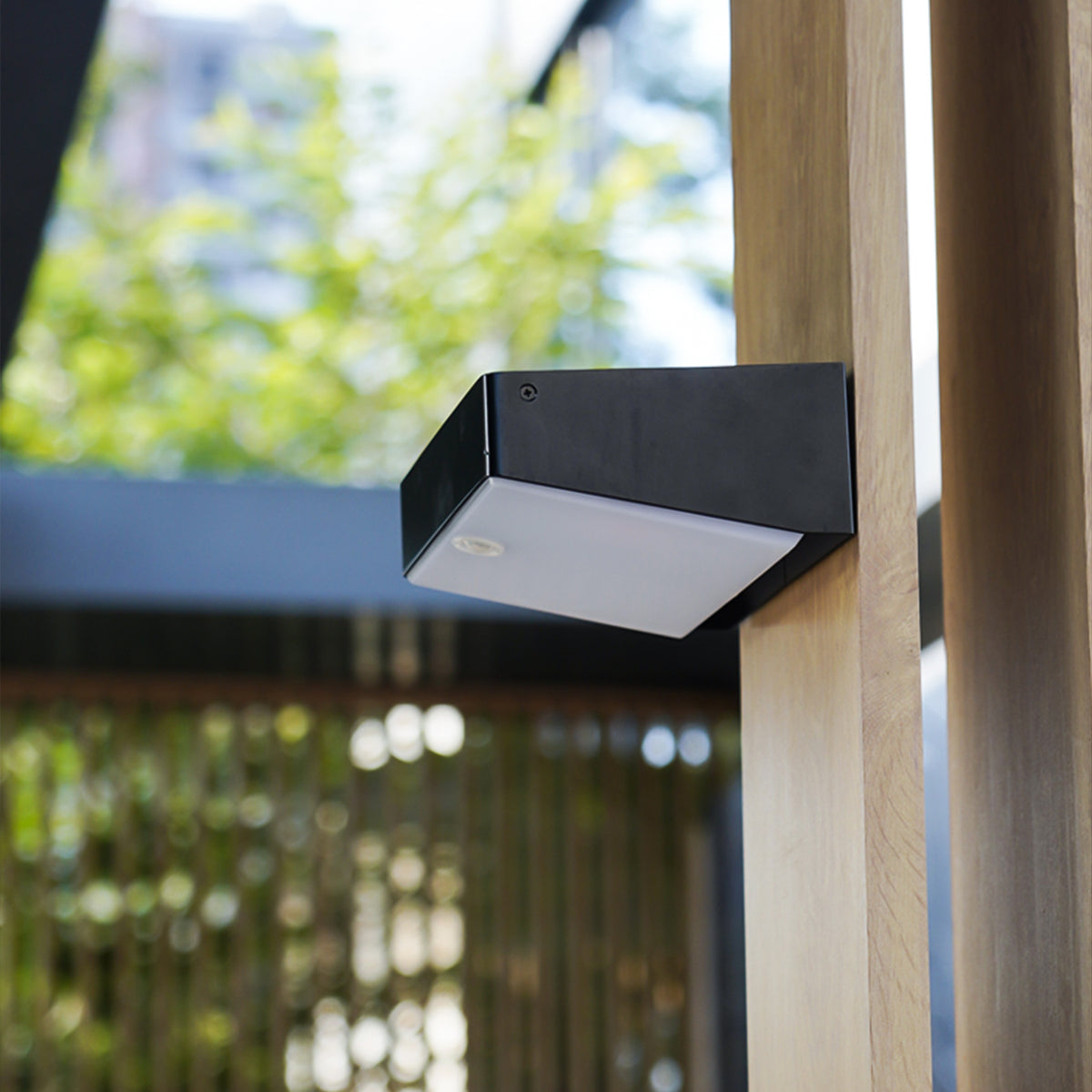 EV-WL-105 solar wall light beside a timber gate