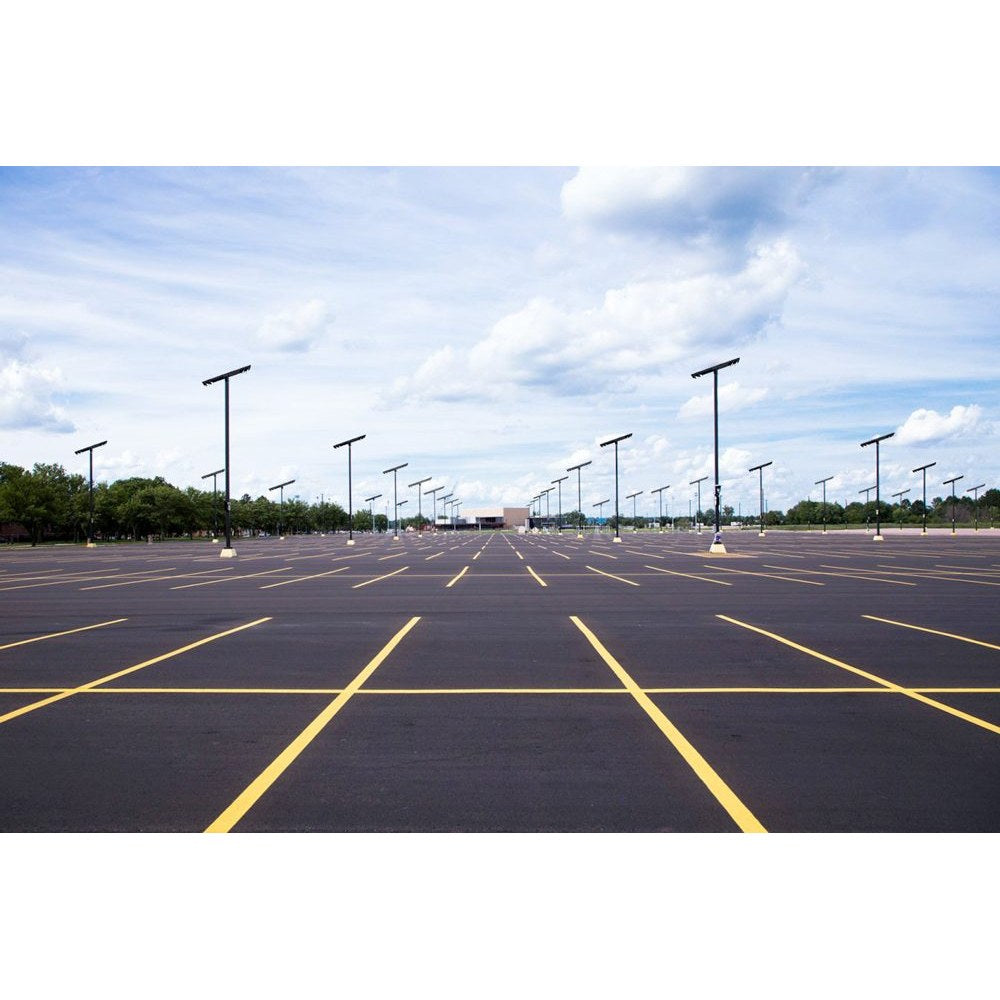 Double-sided solar parking lot light with four LED panels on a pole