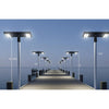 Double-sided solar parking lot light with four LED panels on a pole