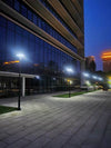 EV-PZ-101 square solar plaza lights along a building walkway