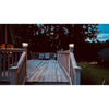 Solar post cap light on a timber fence post