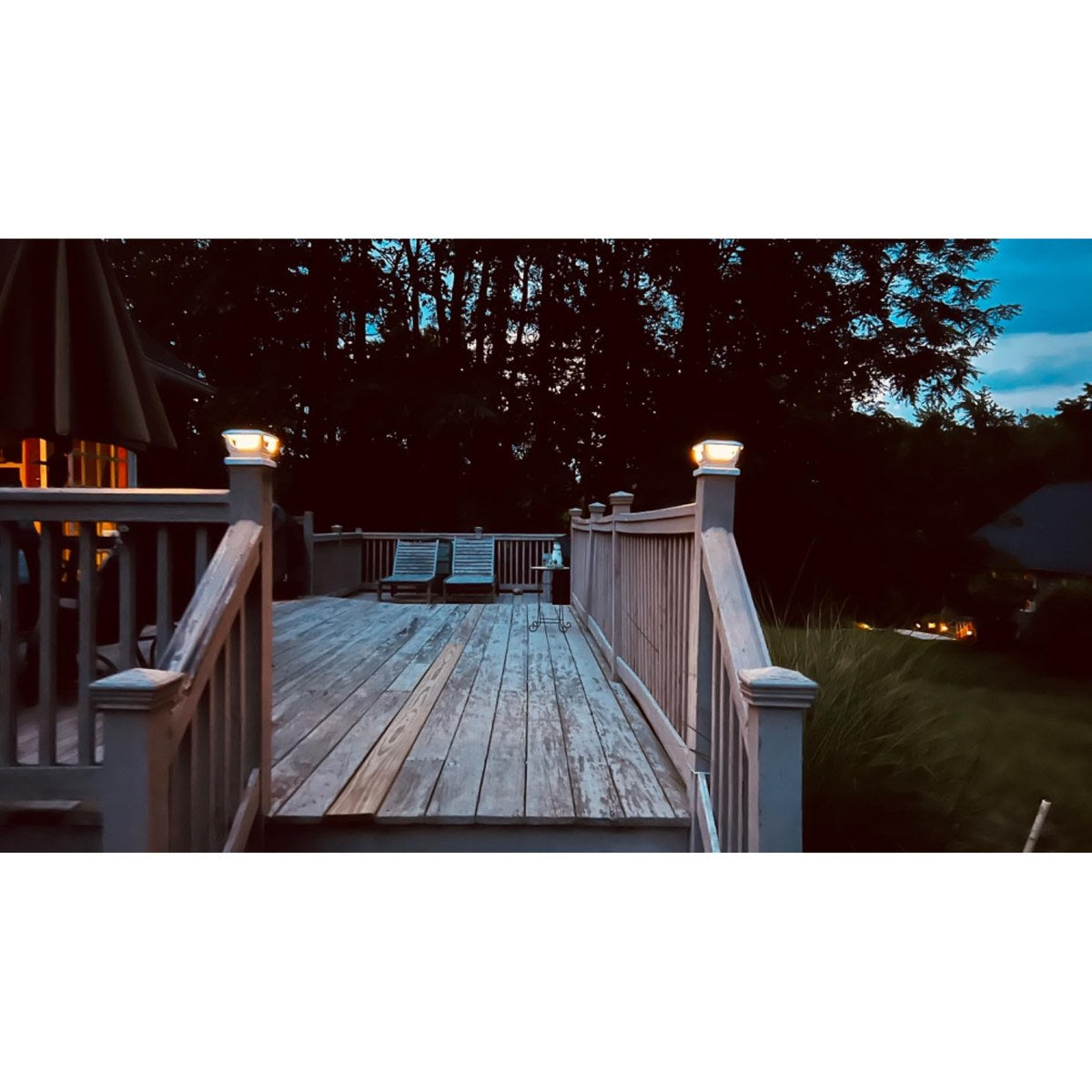 Solar post cap light on a timber fence post