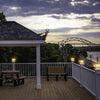 Solar post cap light on a timber fence post