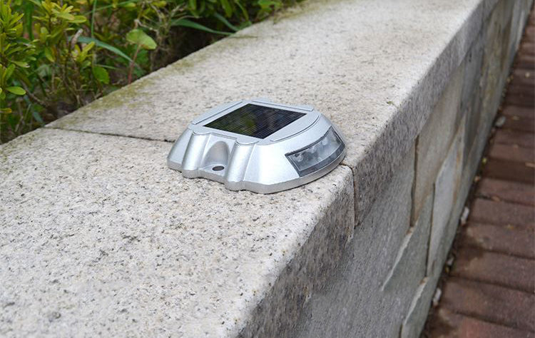 EVIEKO horseshoe solar road stud installed on a kerb