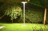 EVIEKO EV-PZ-104 UFO solar plaza light – lit at night on a lawn