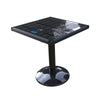 Solar charging coffee table with built-in panel and RGB lighting on a patio
