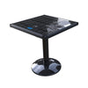 Solar charging coffee table with built-in panel on a patio