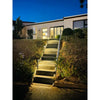 Slim aluminium solar garden bollard light beside a path