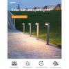 Slim aluminium solar garden bollard light beside a path