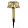 Jellyfish-shaped colour-changing solar garden light on a lawn