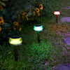 Jellyfish-shaped colour-changing solar garden light on a lawn