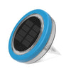 Colour-changing solar lawn light glowing blue in a garden bed