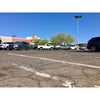 Double-sided solar parking lot light with four LED panels on a pole