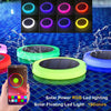 RGBW floating solar pool light changing colours in a swimming pool