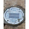 Heavy-duty die-cast aluminium solar road stud on a highway lane line