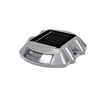 Horseshoe aluminium solar road stud flashing on asphalt at night