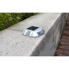 Horseshoe aluminium solar road stud flashing on asphalt at night