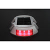 Horseshoe aluminium solar road stud flashing on asphalt at night