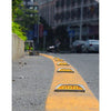 Square aluminium solar road stud flashing on asphalt at night