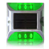 Low-profile yellow solar road stud on a kerb edge