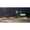 Slim linear solar sign light lamp head mounted above a signboard