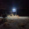 Compact solar sign light illuminating a house number plaque