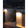 1000 lumen aluminium solar wall light with PIR sensor on a house wall