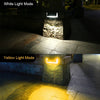 Aluminium solar wall light casting steady white light on an exterior wall